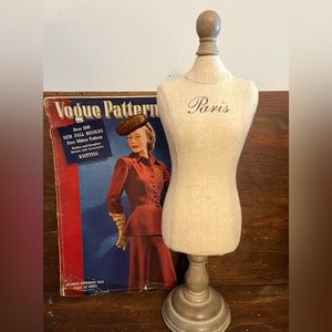 Mannequin jewelry holder marked Paris across chest on pedestal stand